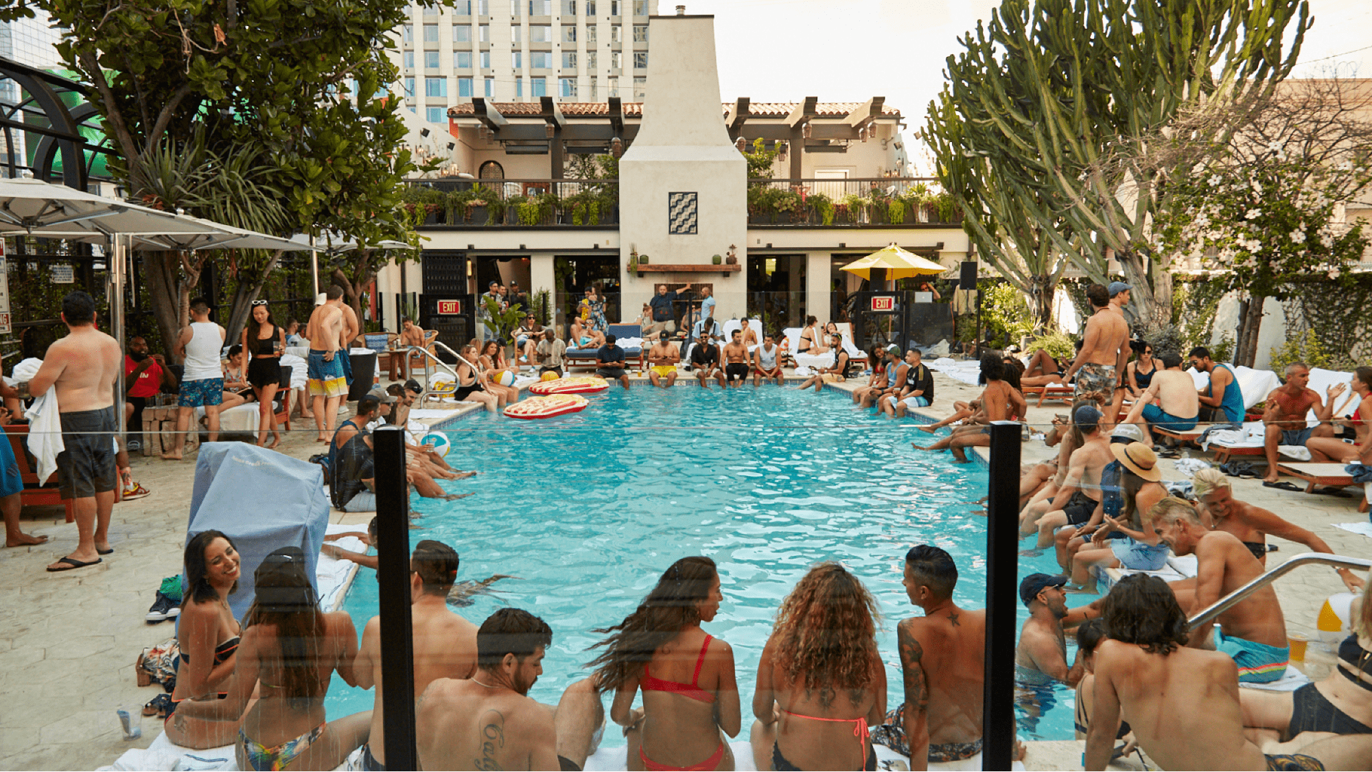 Dozens of people at a pool party