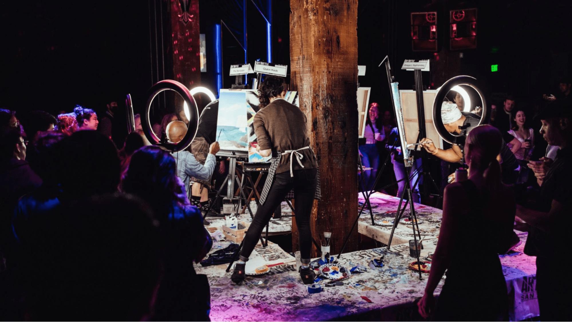 Artists painting in a competition